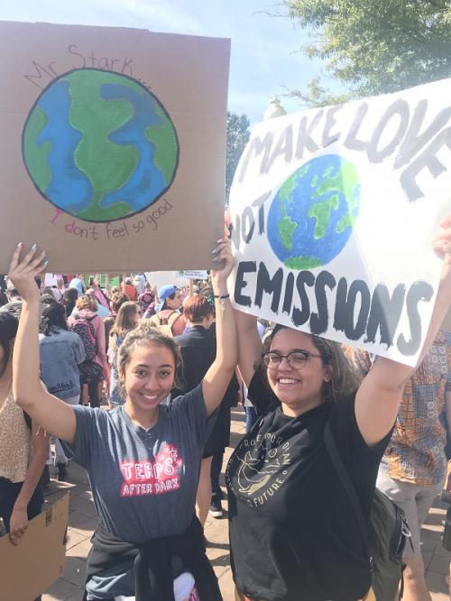 Students holding protest signs