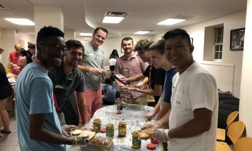 Students making peanut butter and jelly sandwiches